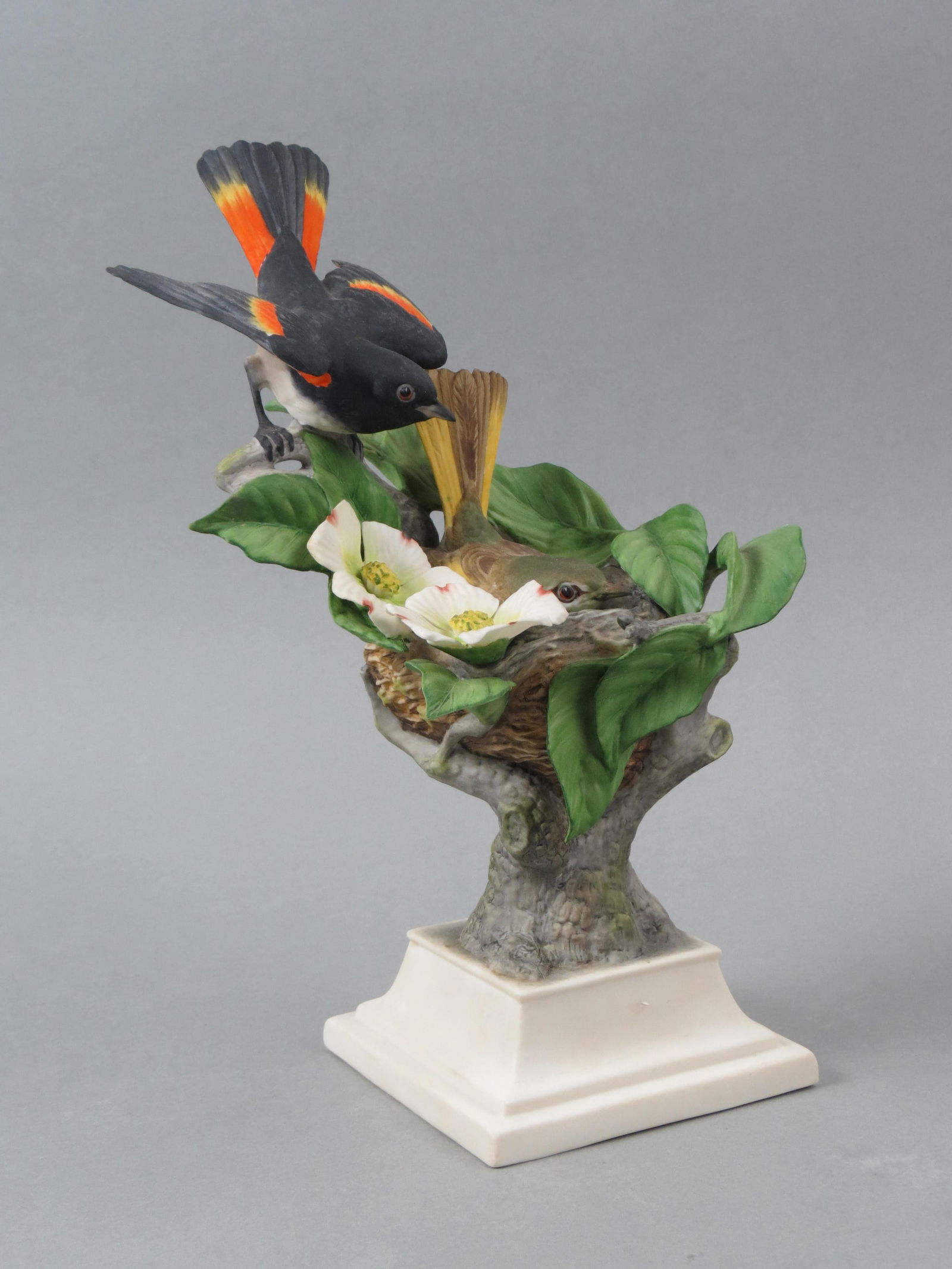 Boehm Porcelain Figurine "American Redstarts", #447, limited edition, 11" tall, 6" wide.: Boehm Porcelain Figurine "American Redstarts", #447, limited edition, 11" tall, 6" wide......Founded as E.M. Boehm Studios by Edward Marshall Boehm (1913â€“1969) in 1950, the company is best know