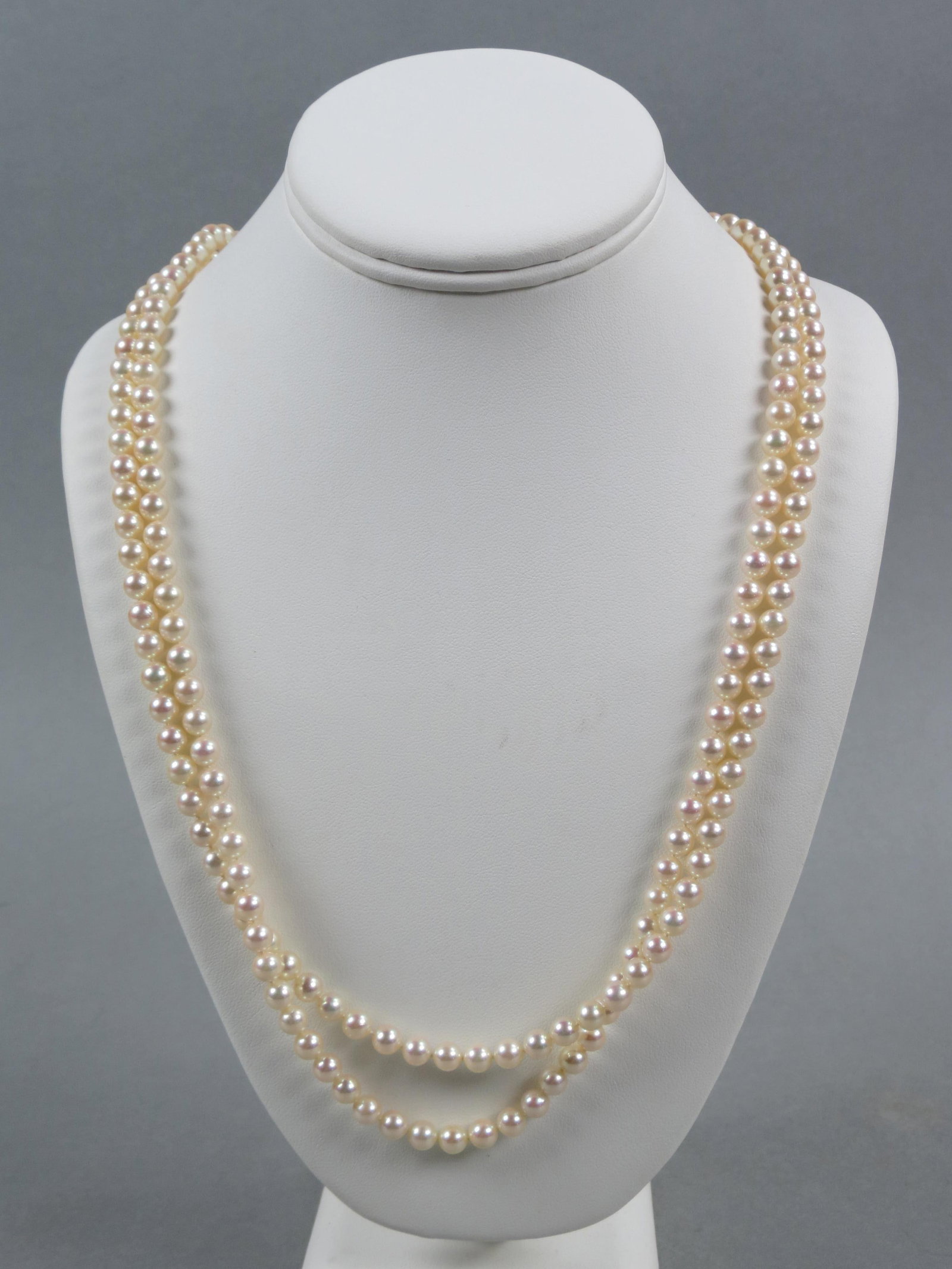 Pearl Necklace with Diamond 18k Gold Clasp, 196 pearls, 6 mm cream rose color, 18k yellow gold: Pearl Necklace with Diamond 18k Gold Clasp, 196 pearls, 6 mm cream rose color, 18k yellow gold clasp with 40 round diamonds totaling .50 carat, high grade, with appraisal of $5,850.00, 25" long.