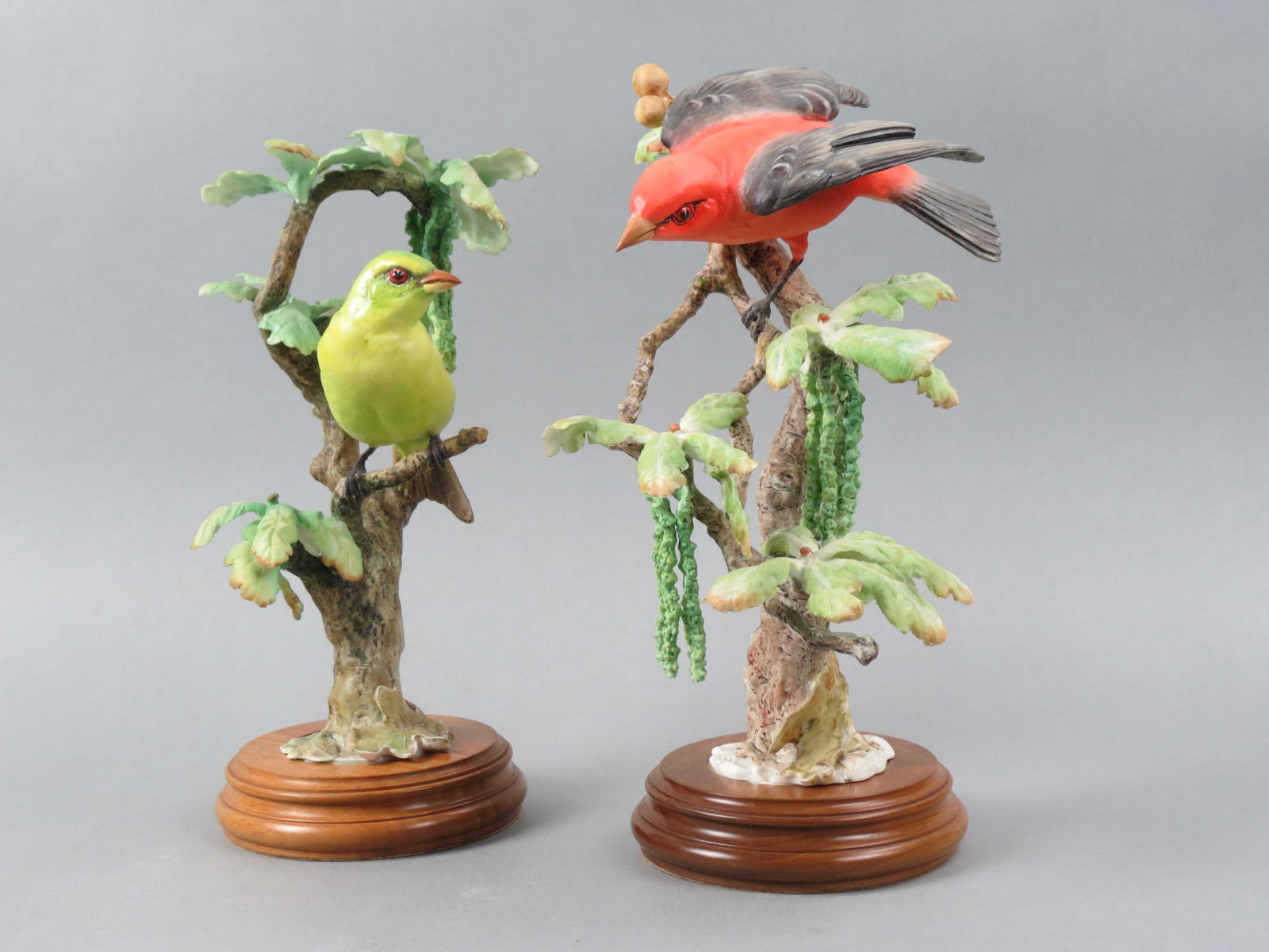 Pair of Royal Worcester Birds by Dorothy Doughty, "Scarlet Tanagers & White Oak", male and female,: Pair of Royal Worcester Birds by Dorothy Doughty, "Scarlet Tanagers & White Oak", male and female, issued in 1956, 11 1/2" plus wooden bases...Dorothy Doughty was born in San Remo, Italy in 1892. Her