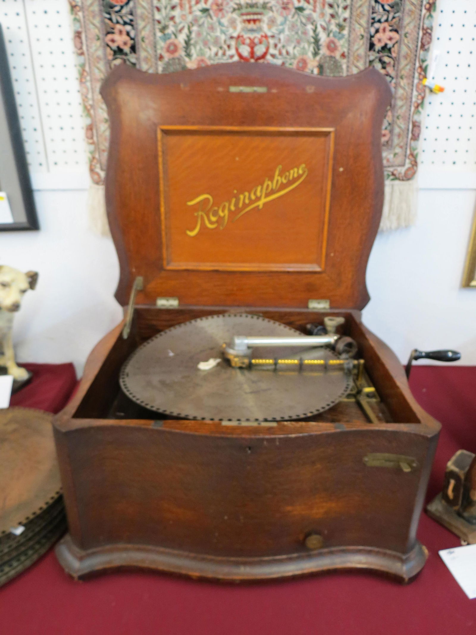 Rare Reginaphone Disc & Record Player from 1890's, with 14 discs (15 1/2"), with group of 78 rpm: Rare Reginaphone Disc & Record Player from 1890's, with 14 discs (15 1/2"), with group of 78 rpm records, oak case, serial #1500085, 26" X 22", 13" tall...............The Regina Company was establishe