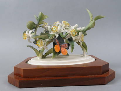 Royal Worcester Bird Figurine by Dorothy Doughty, "Orange Blossom & Butterfly", 9 1/2" long, 6 1/2": Royal Worcester Bird Figurine by Dorothy Doughty, "Orange Blossom & Butterfly", 9 1/2" long, 6 1/2" tall plus wood base.....Throughout its rich history, Royal Worcester became synonymous with the prod