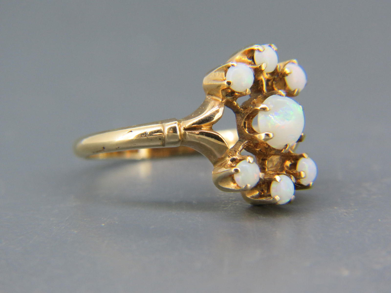 Opal 10K Gold Ring, 7 fiery cabochon cut gems in 10k yellow gold, 3.1  grams, currently size 6 1/4. (1 of 5)