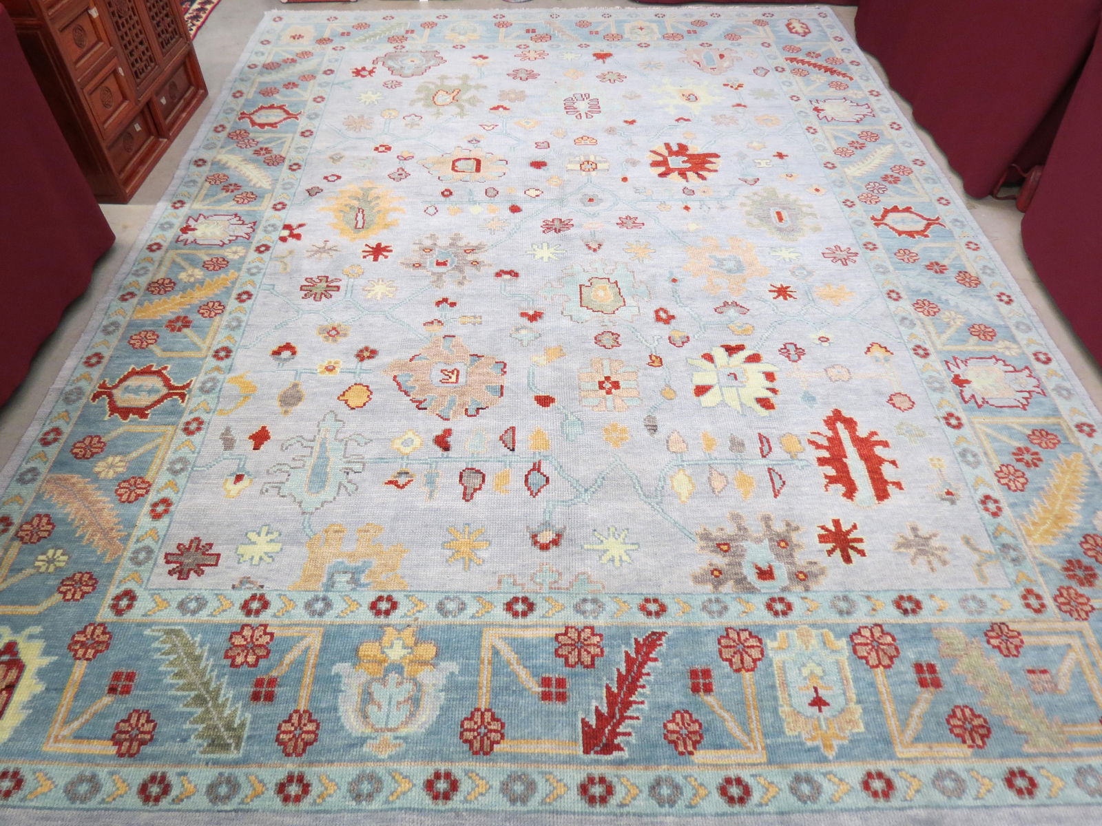 Oushak Handmade Room Size Rug, stylized floral on soft blue field, 9' X 12'. (1 of 5)