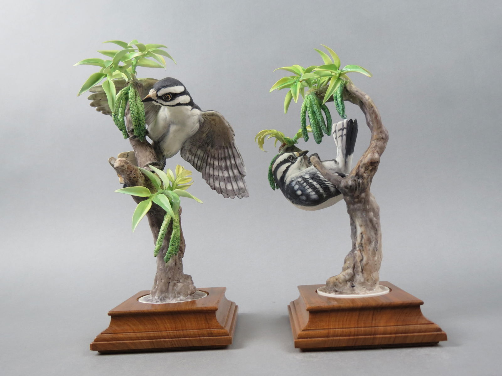 Pair of Royal Worcester Birds by Dorothy Doughty, "Woodpeckers and Pecans", male and female, issued: Pair of Royal Worcester Birds by Dorothy Doughty, "Woodpeckers and Pecans", male and female, issued in 1968, 10" tall plus wood bases, with original wooden boxes....Dorothy Doughty was born in San Rem