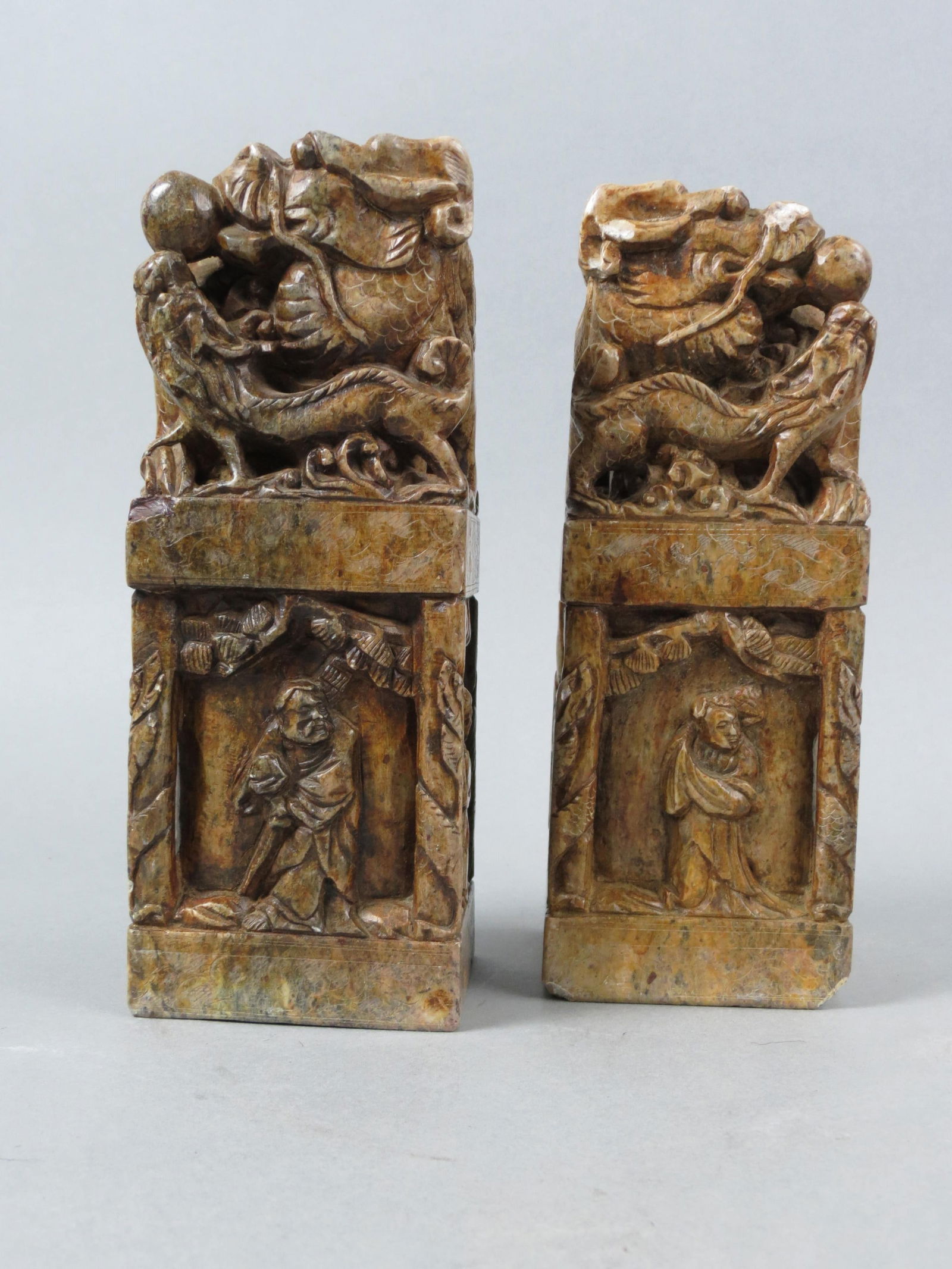 Pair of Chinese Carved Soapstone Seal Stamps, dragons above figures in panel design, 8" tall. (1 of 6)