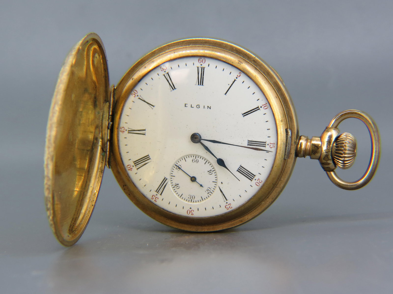 Elgin Pocketwatch, hunting case, 1906, finely engraved gold-filled case, model 1883, 15 jewels, 18: Elgin Pocketwatch, hunting case, 1906, finely engraved gold-filled case, model 1883, 15 jewels, 18 size, serial #15365498, currently runs then stops, needs a cleaning.