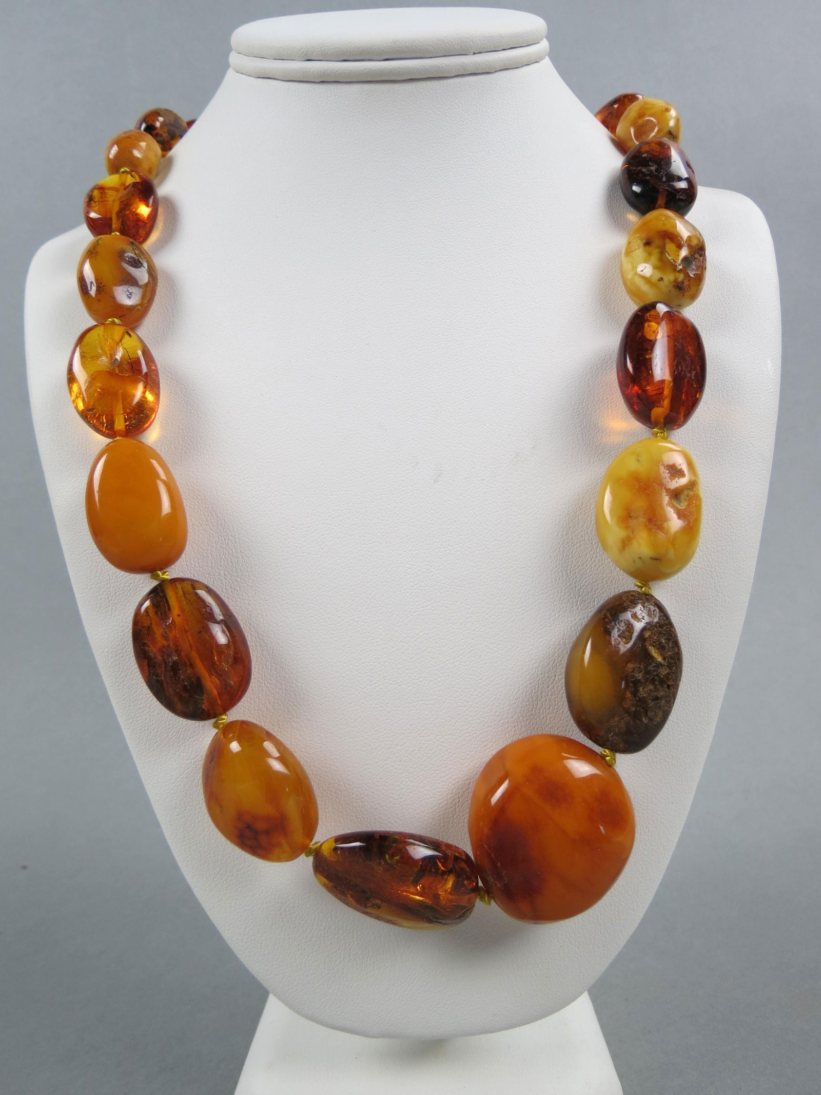 Amber Bead Necklace, graduated, 35 oval beads in various colors, 92  grams, 35" long. (1 of 4)
