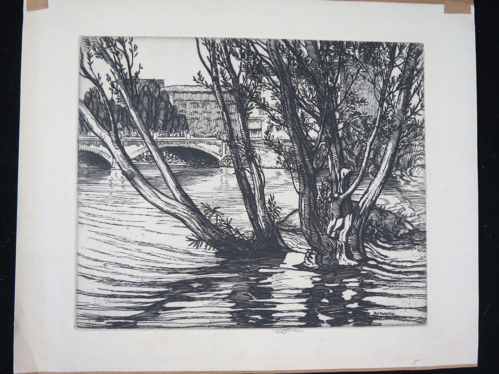 Roi Partridge, etching, A River Island, with trees and rocks, bridge and city in  background, image (1 of 2)