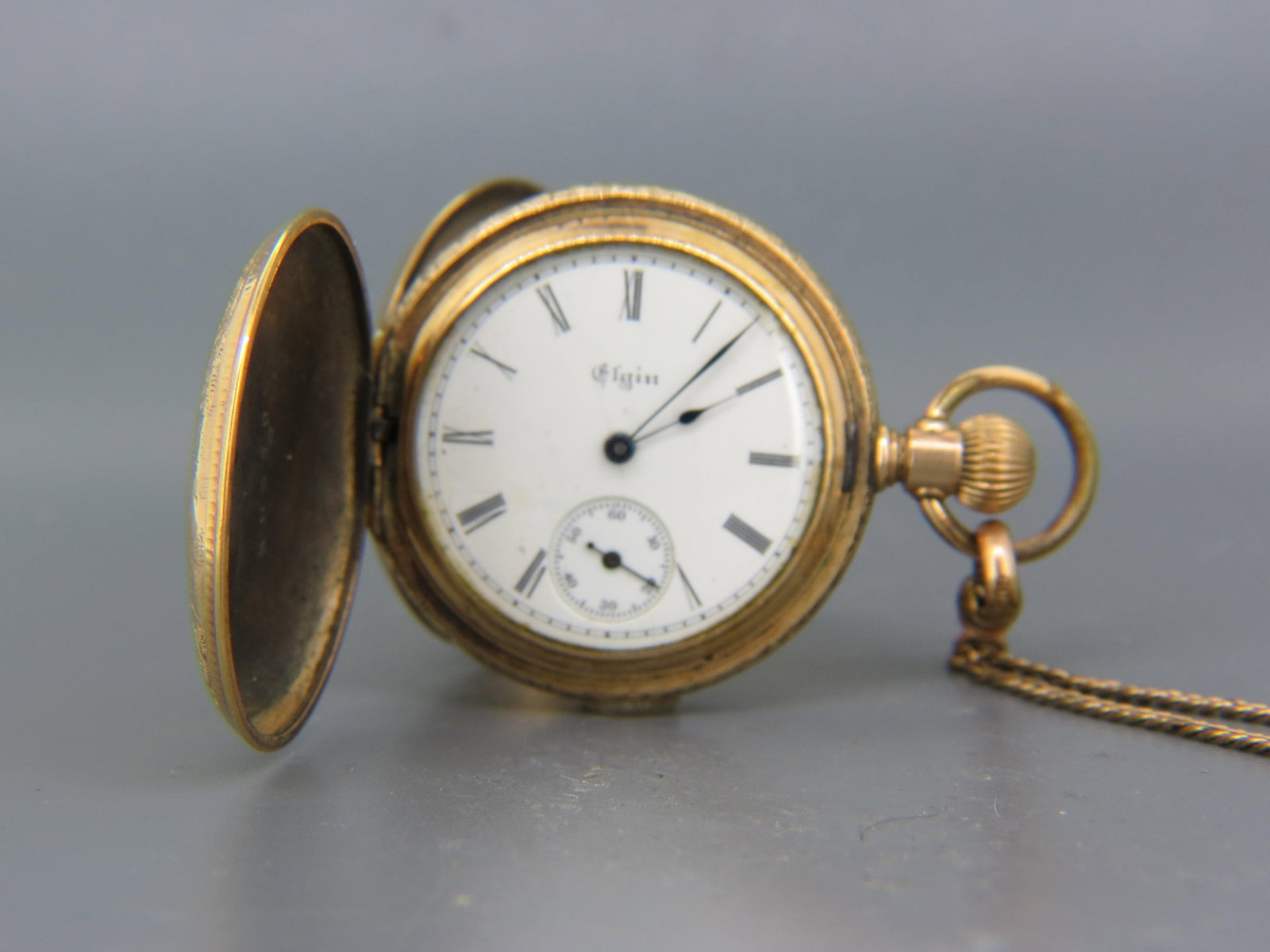 Elgin Pocketwatch or Pendant Watch, 1899, finely engraved gold-filled case, 11 jewels, "0" size,: Elgin Pocketwatch or Pendant Watch, 1899, finely engraved gold-filled case, 11 jewels, "0" size, serial #8210510, along with a gold-filled slide chain, working.