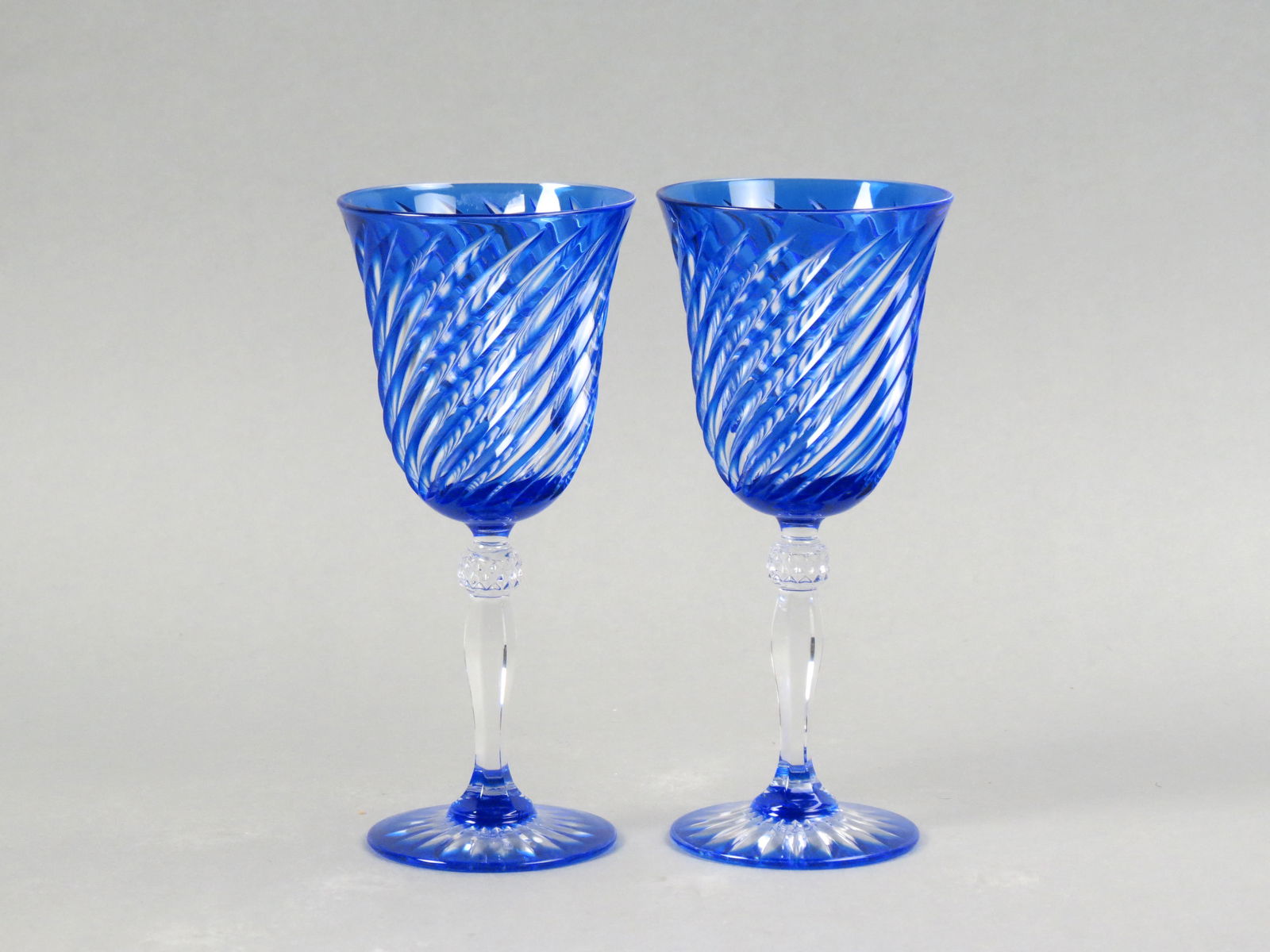 Pair of Blue Cut-to-clear Wine Goblets, rich sapphire blue with swirl cut design, 8", unsigned,: Pair of Blue Cut-to-clear Wine Goblets, rich sapphire blue with swirl cut design, 8", unsigned, excellent.