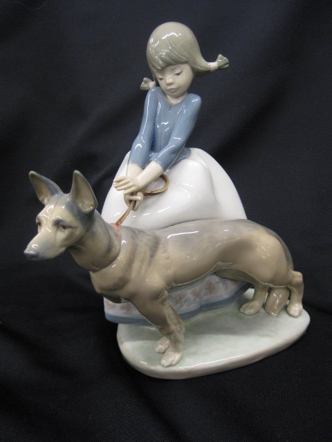 Lladro Porcelain Figurine of Young Girl: and German shepard, 8" tall, excellent.