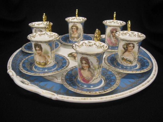Victorian Porcelain Portrait Tea Tray with 6 cups: 6 cups & saucers, various ladies of Royality, turquoise & gold band, by Higgins & Seiter, Austria, handles tray is 15" diameter, light gold wear on tray rim otherwise excellent.....Higgins & Seiter wa