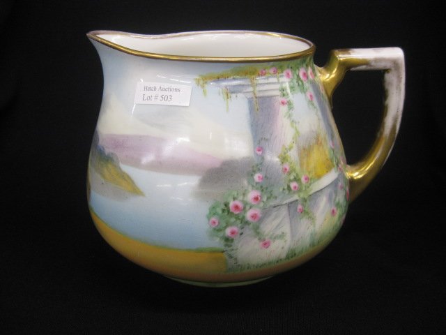 Pickard Handpainted Porcelain Cider Pitcher,: garden scene with lake & mountains in distance, artist signed Gasper, 6 1/2", gold wear otherwise excellent....Pickard had been created during the turn-of-the-century Arts and Crafts Movement. Althoug