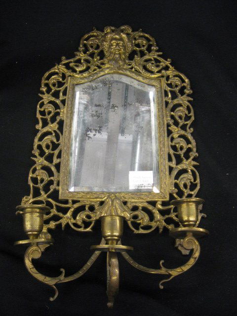 Victorian Bronzed Wall Mirror,: god at top, trio of candle sconces below, 18" x 10", attributed to Bradley & Hubbard.