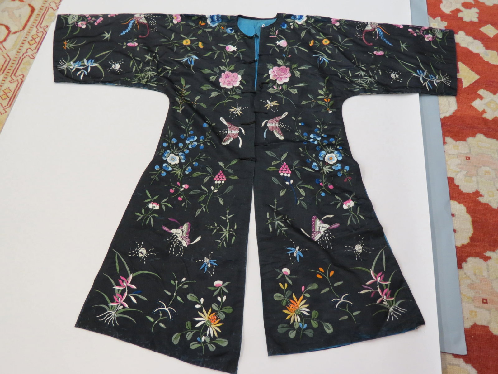 Chinese Embroidered Silk Robe,: butterflies and floral decor on black, approx. 48" long, 39" wide.