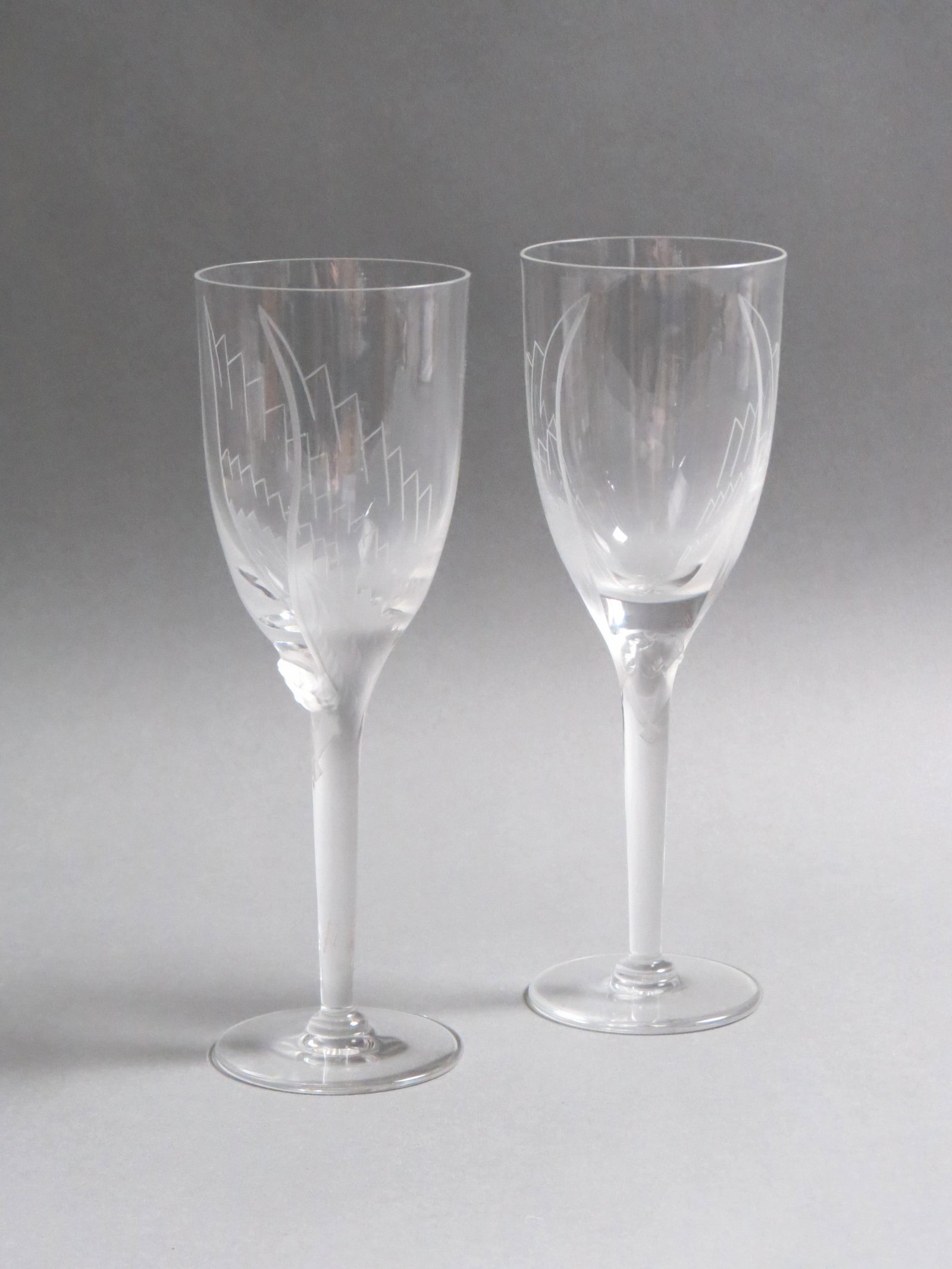 Pair of Lalique Crystal Fluted Champagnes, "Ange",: etched and frosted angel design, 8" signed, excellent..retail $295.00 each