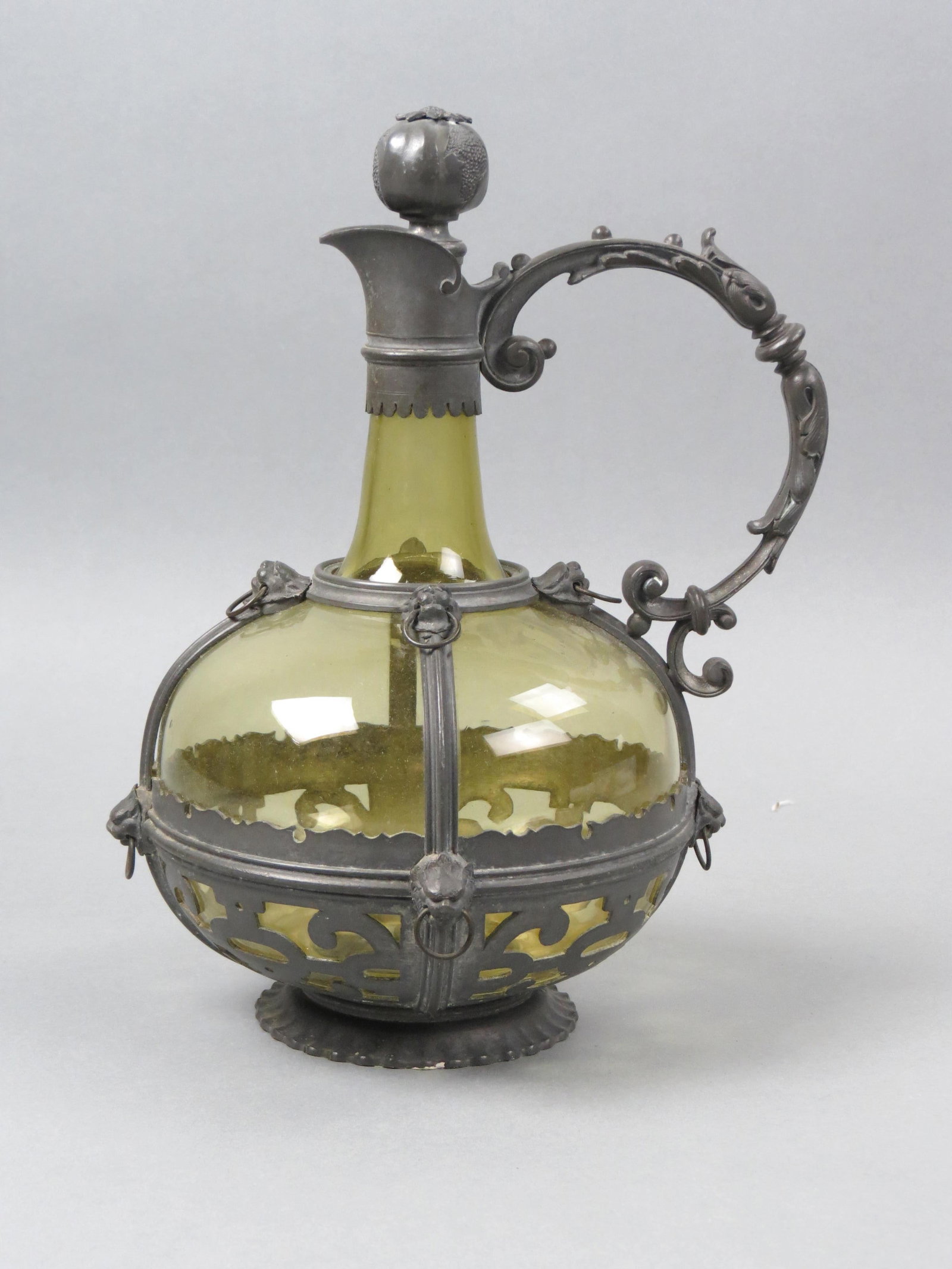 German Pewter Mounted Art Glass Decanter,: lion and ring decor on forest green, 10 1/2", circa 1900, excellent.