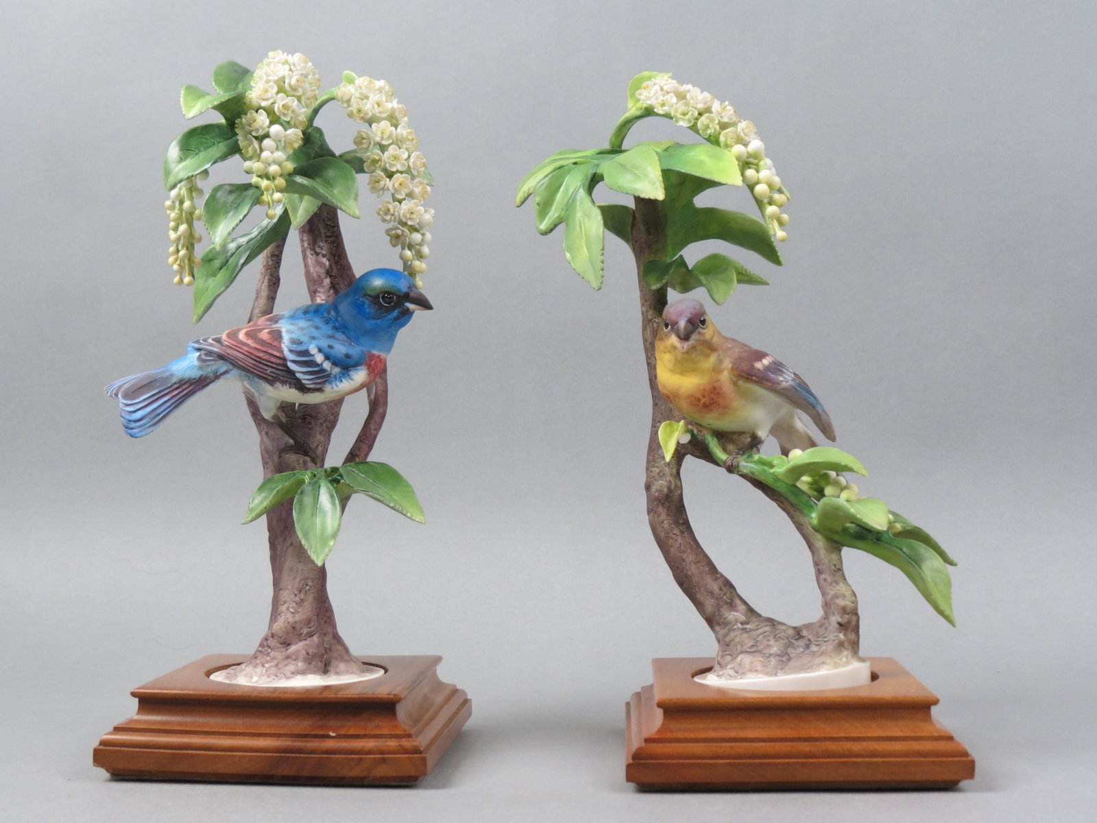 Pair of Royal Worcester Dorothy Doughty Birds,: Lazuli Bunting with Choke Cherry, male and female, 10 1/2" plus wooden bases, with original wooden boxes, 1962, one has one leaf chip, rest excellent.....NOTE: DUE TO THIS ITEM BEING VERY FRAGILE, AND