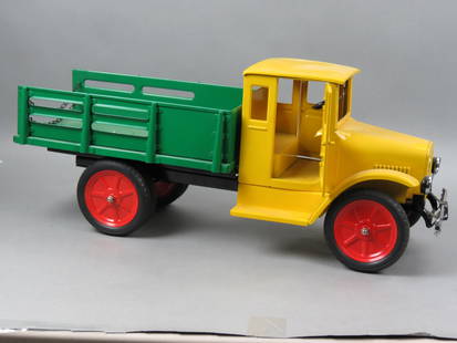 Buddy L Line Metal Truck,: by T-Reproductions, pressed steel, yellow body and green flat bead with rails, (circa 1930 model), limited edition, 26" long, 11 1/2" tall, no box.