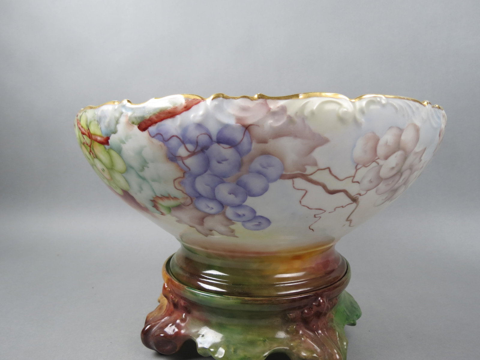 Fine Hand Painted Limoges Punchbowl & Stand,: multi-color grape clusters and vine decor inside and out, artist signed B.P. Galiher, 1909, 14 1/2" diameter bowl, 9 1/2" tall on stand, no chips, cracks or repairs, only some gold wear on rim, a beau