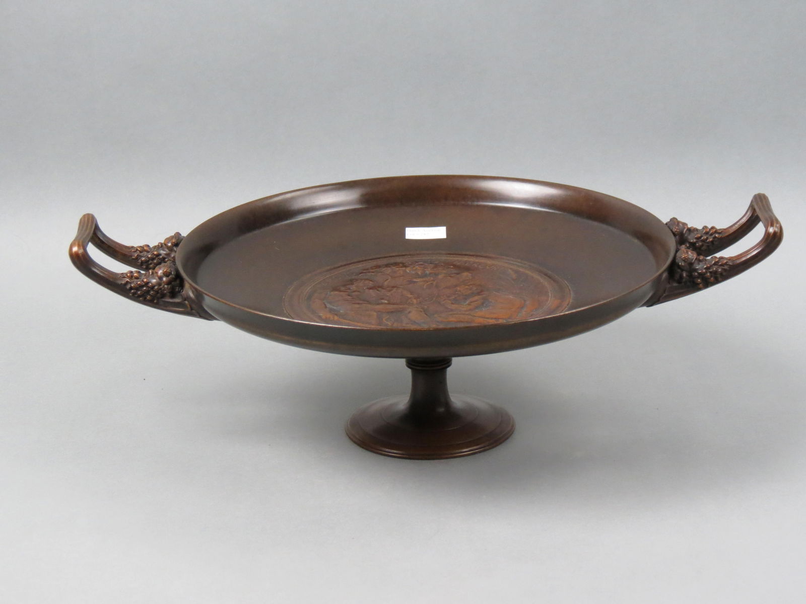F. Levillain Bronze Centerpiece Tazza, Ferdinand Barbedienne,: signed by Ferdinand Barbedienne also, with nude male figures within center medallion "Argus 10 Mercure", signed and dated 1882, fine patina, pedestal base....18 3/4" across handle end to handle end, 1