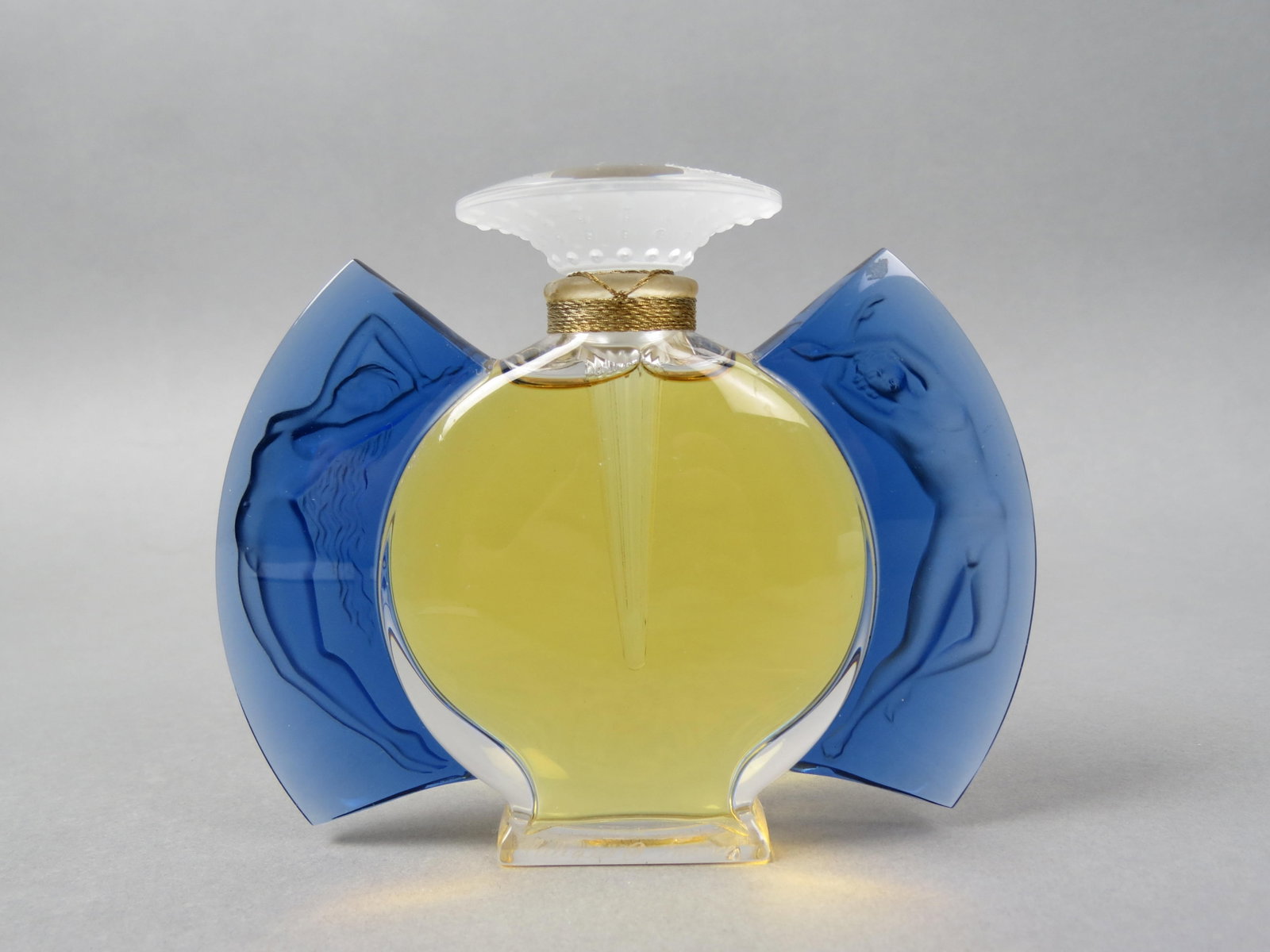 Lalique Crystal Perfume Bottle "Timeless",: Art Deco style with nude man and woman on cobalt side panels, limited edition, still sealed, complete, 4" tall, 5" wide, signed, excellent.
