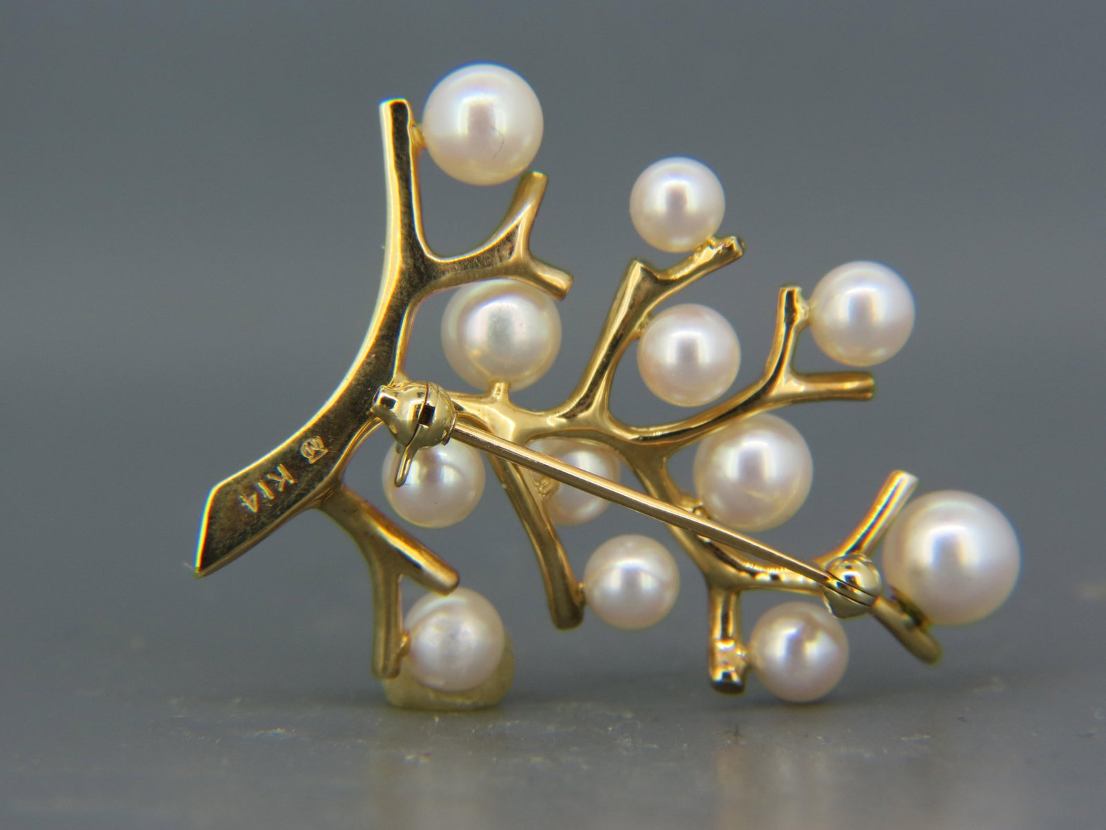 Mikimoto Pearl & 14K Gold Tree of Life Brooch,: 12 lustrous pearls most 5 to 6 mm, 14K yellow gold, 9 grams, signed, excellent.