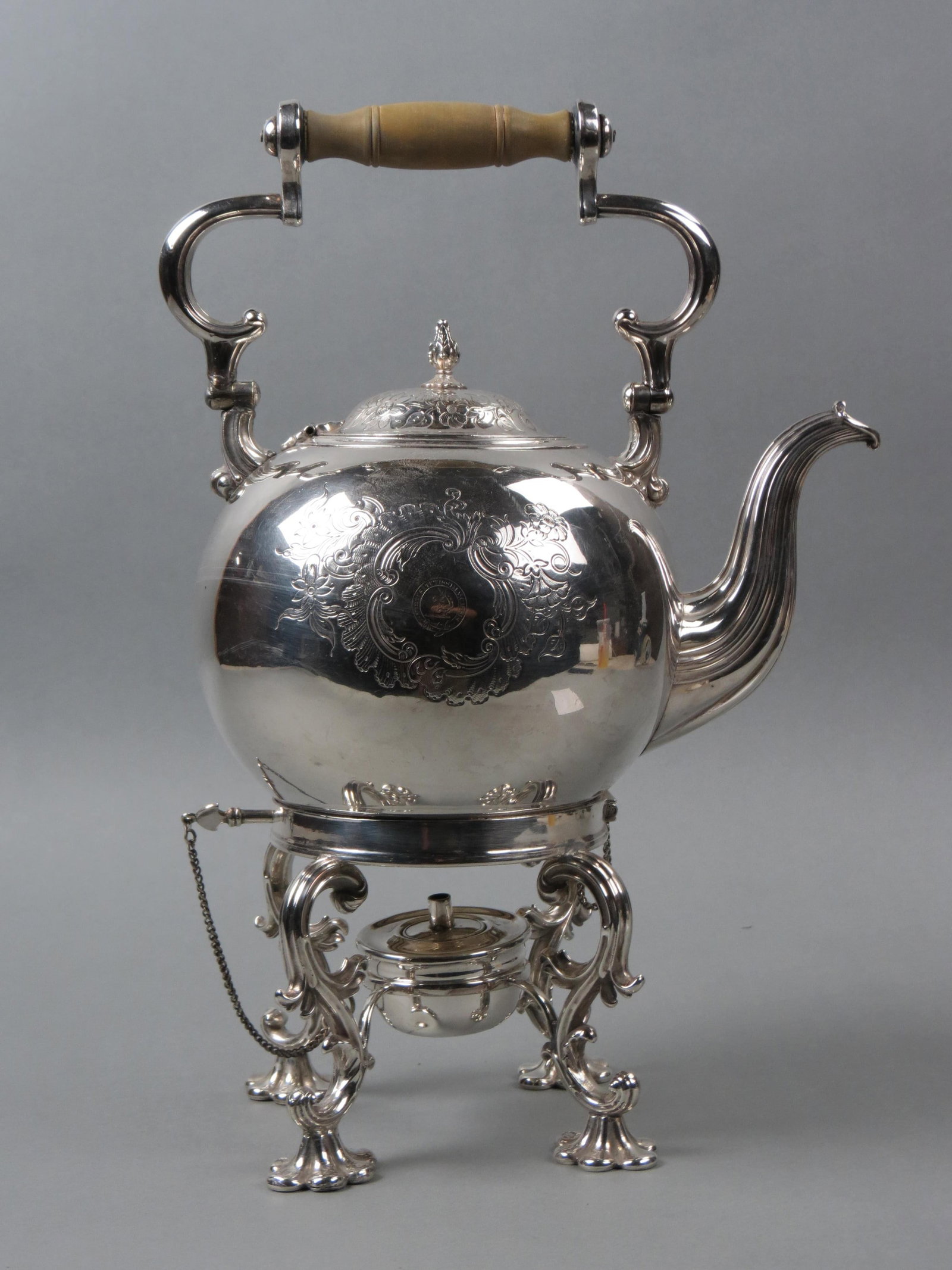 English Silverplate Hot Water Kettle on Stand,: elaborate base with burner, swing handle, fine floral and engraved crest, 12" tall, mid 19th century.