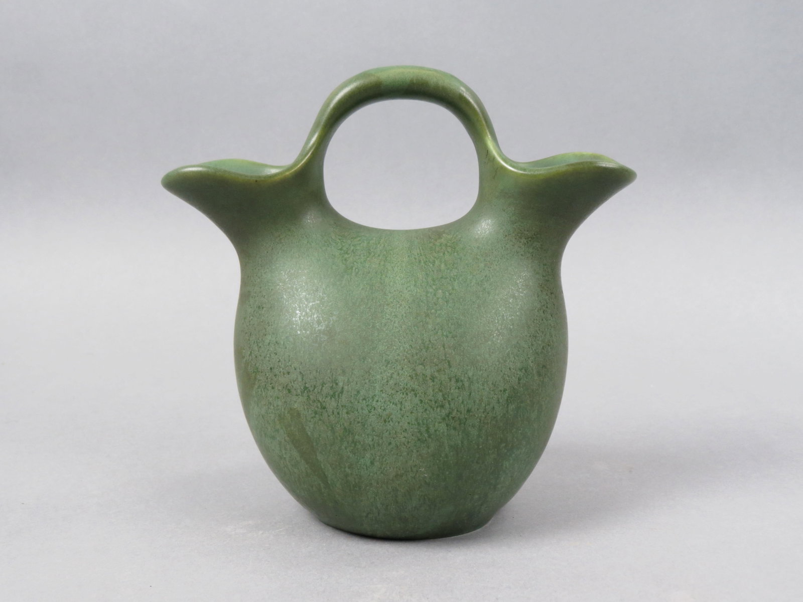 Hampshire Pottery Wedding or Loving Vase,: Arts & Crafts style, matt green, double spout, 6 1/2", signed, excellent.....Hampshire Pottery began production in 1871, and was founded by James Taft. In 1904, Cadmon Robertson joined Hampshire Potte