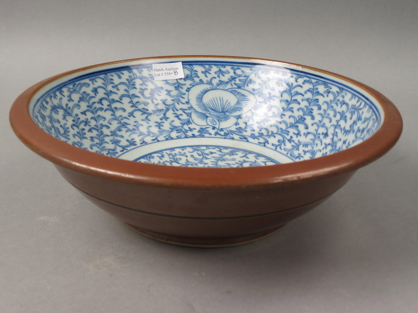 Chinese Porcelain Qing Dynasty Bowl,: overall blue flowering vine interior, brown exterior, 11" diamter, 3 1/2" deep, excellent.