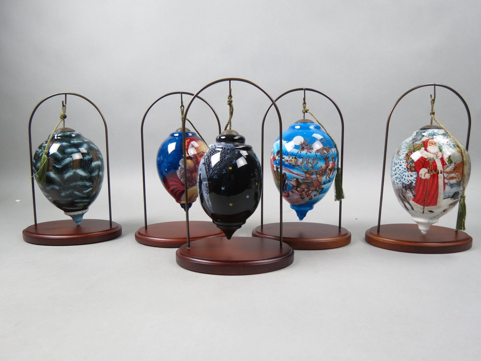 5 Ne'Qwa Art Glass Christmas Ornaments,: limited editions, with boxes and display stands, largest is 6", one has 4 smaller matching ornaments in box.