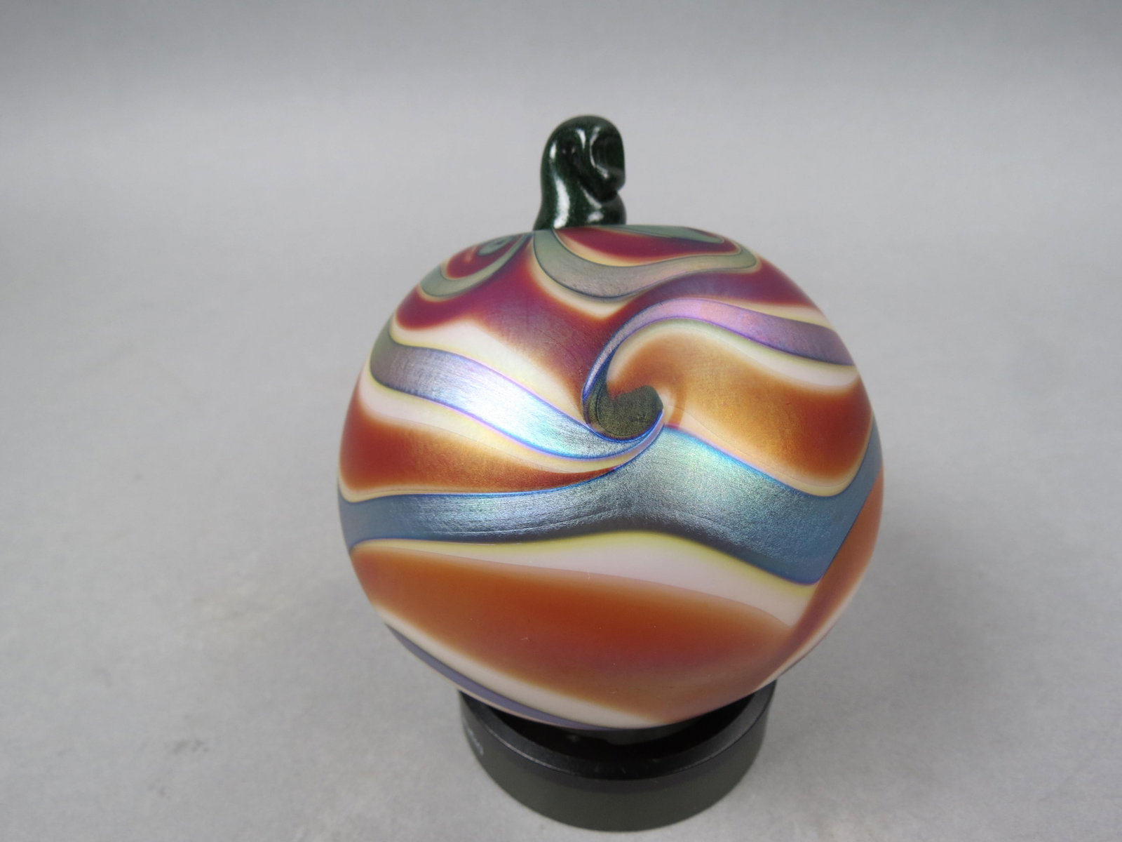 Charles Lotton Studio Art Glass Christmas Ornament: with iridescent silvery blue on golden brown and white swirling design, 4" ball form, signed Charles Lotton, 2004, excellent.