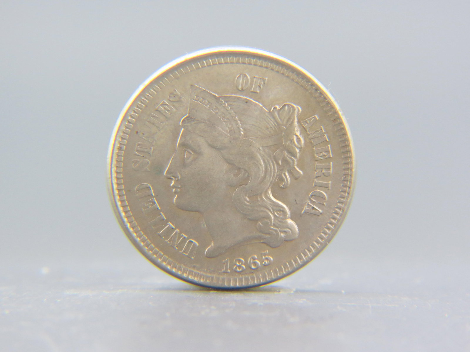 1865 U.S. Three Cent Nickel, uncirculated, (1 of 2)