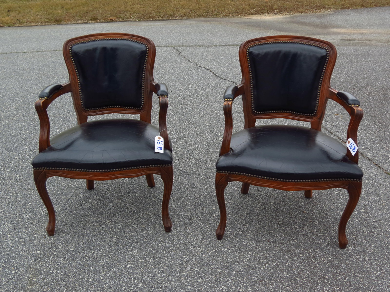 Pair of Black Leather & Mahogany Arm Chairs,: brass "nailhead" trim, 23" X 24", 33" tall (backs).