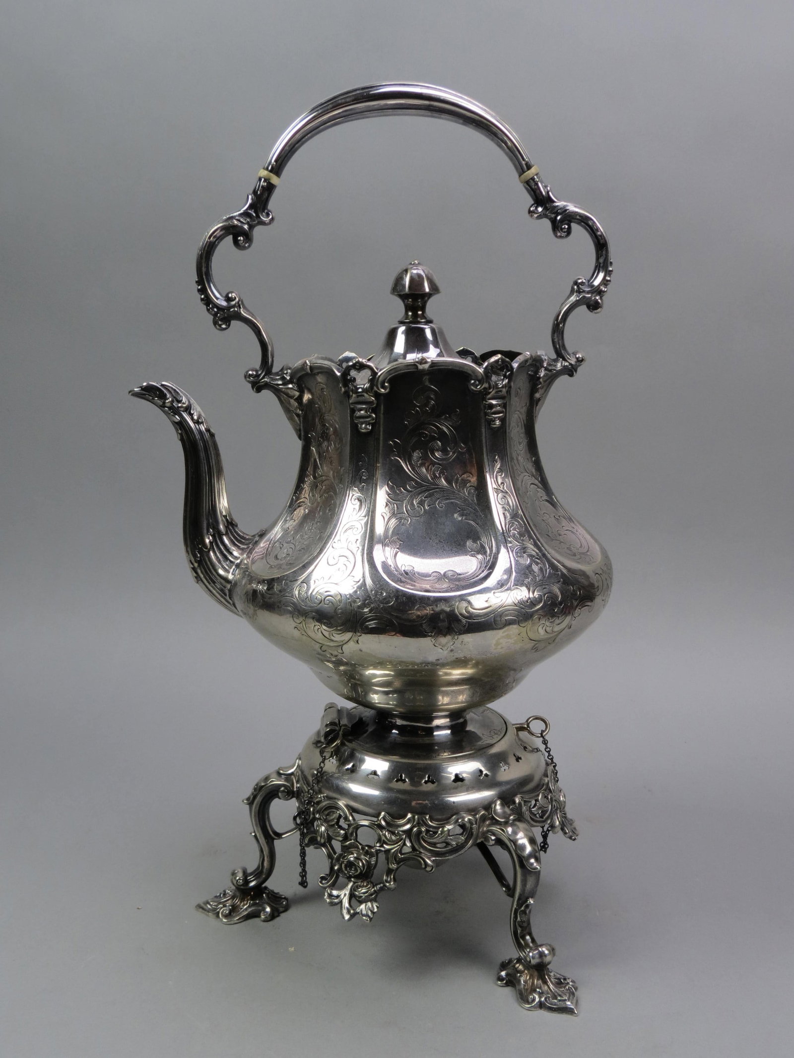 English Silverplate Hot Water Kettle on Stand,: elegant engraving and openwork with rococo stand, has burner, engraved crest, 19th century, overall 18" tall.