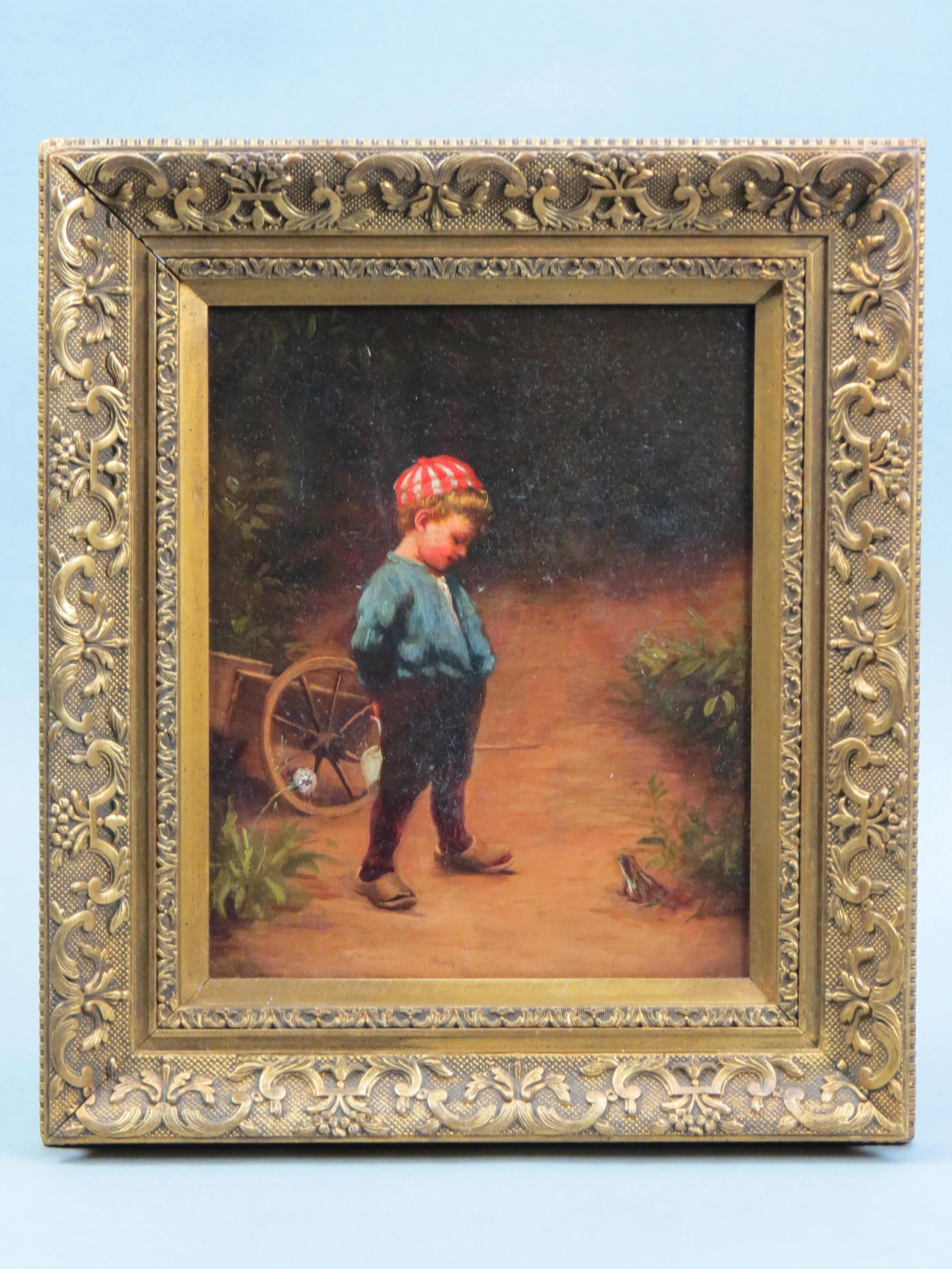 Antique Oil Painting of Boy and Frog, The Young Biologist": after Paul peel, well known Canadian artist, he is holding a pail behind him getting ready to trap the frog, cart in background, on canvas, unsigned, image area 8" X 10" plus frame.