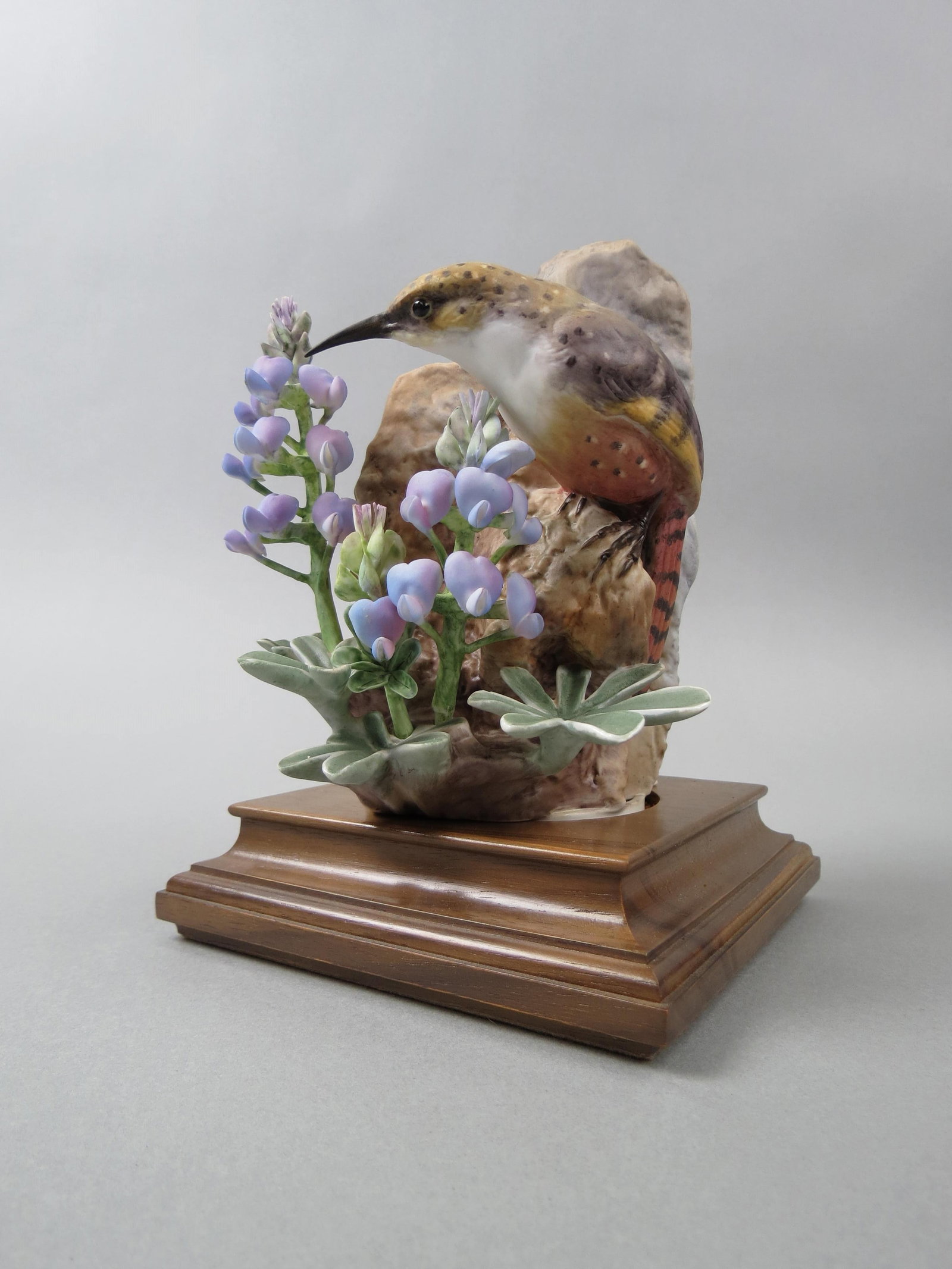 Royal Worcester Dorothy Doughty Bird Figurine,: "Canyon Wren with Wild Lupin", female, 6 1/2" plus wooden base, no damage found, with wooden box.