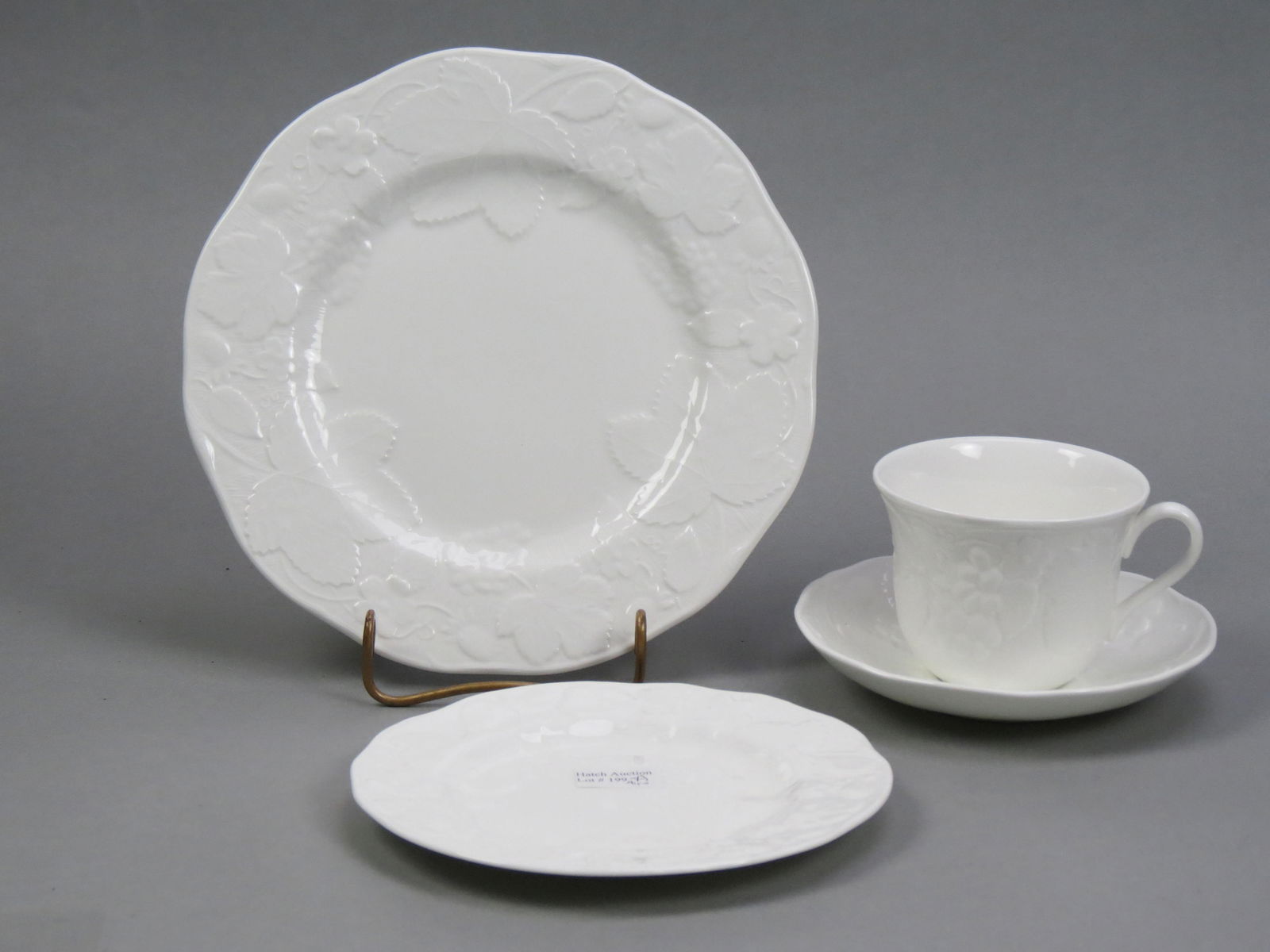 41 pcs. Wedgwood China "Strawberry & Vine",: classic white, embossed design, includes 8 dinner plates, 8 salad plates, 8 bread plates, 8 cups, 8 saucers and an oval vegetable bowl, all excellent.