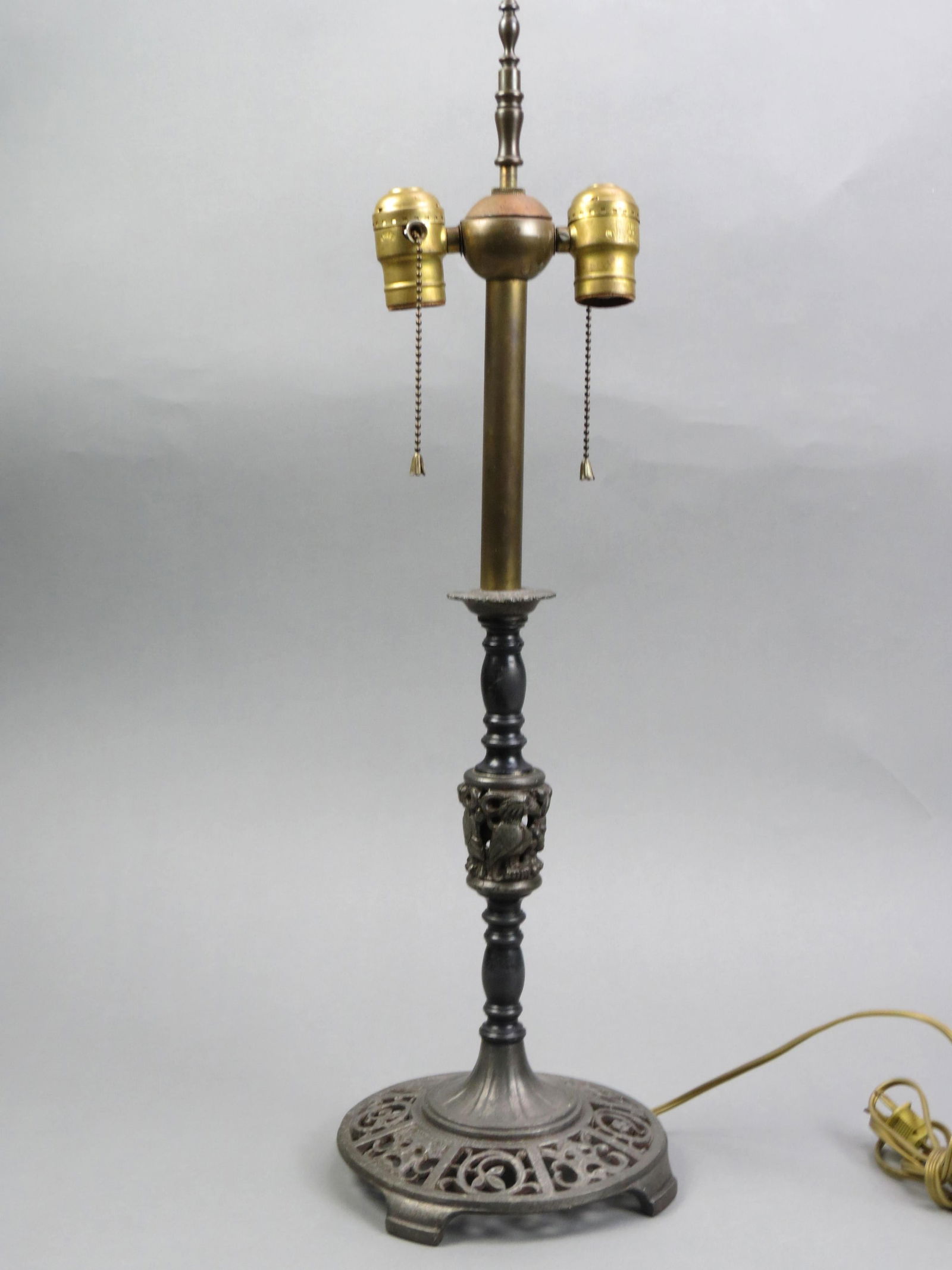Oscar Bach Studios Metalwork Lamp,: Art Deco, birds on column, "Tragedy Comedy" openwork faces and leaf designs on base, overall 25" tall, signed.....German-born Oscar Bach was one of the most talented and commercially successful metalw