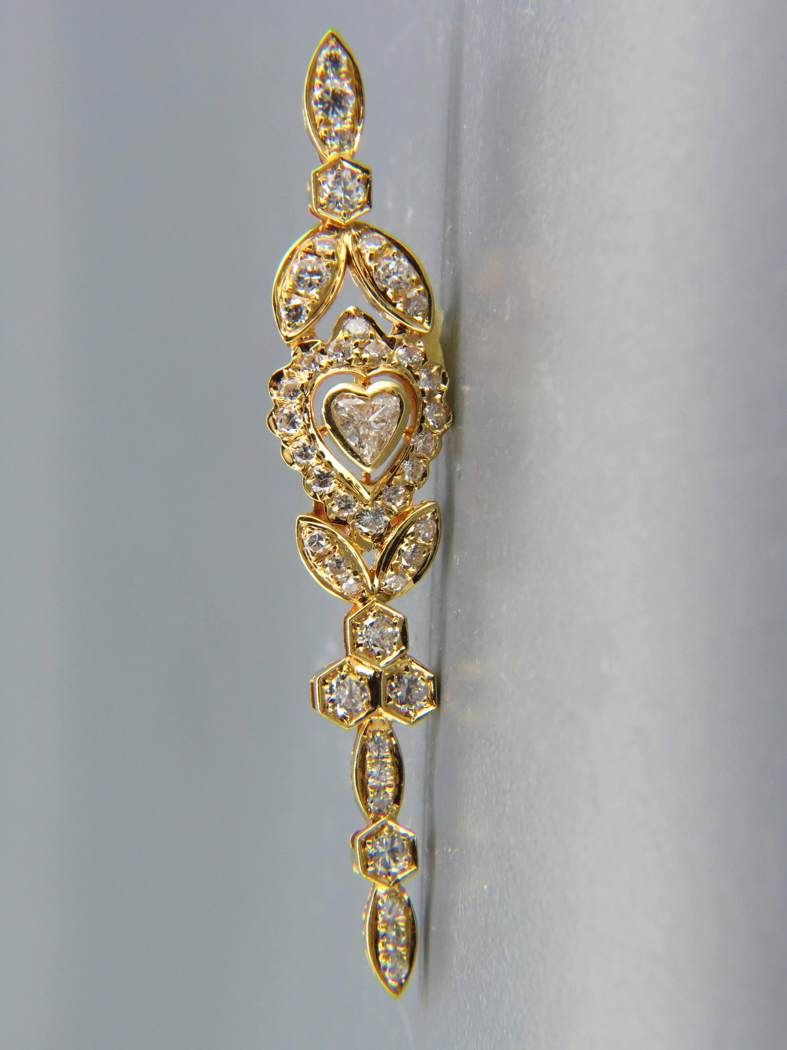 Diamond 18K Gold Pendant,: heart shape diamond with 42 round diamonds totaling 1.50 carats, 18K yellow gold, with appraisal of $4,350.00, 2 1/4" long.