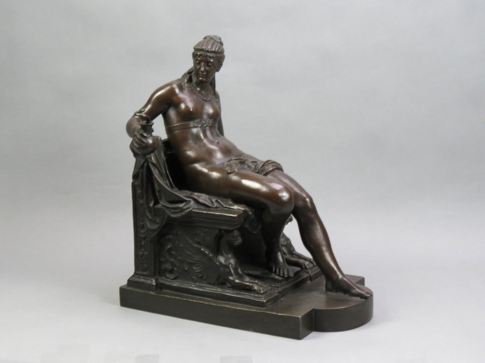 Wilhelm Volz, bronzed, "Cleopatra, on Throne",: semi-nude, holding a vessel with emerging snake, signed and dated 1878, Rome, 17 1/2" tall, 16" long, excellent........A history and genre painter, Wilhelm Volz was born in Karlsruhe on 8 December 185