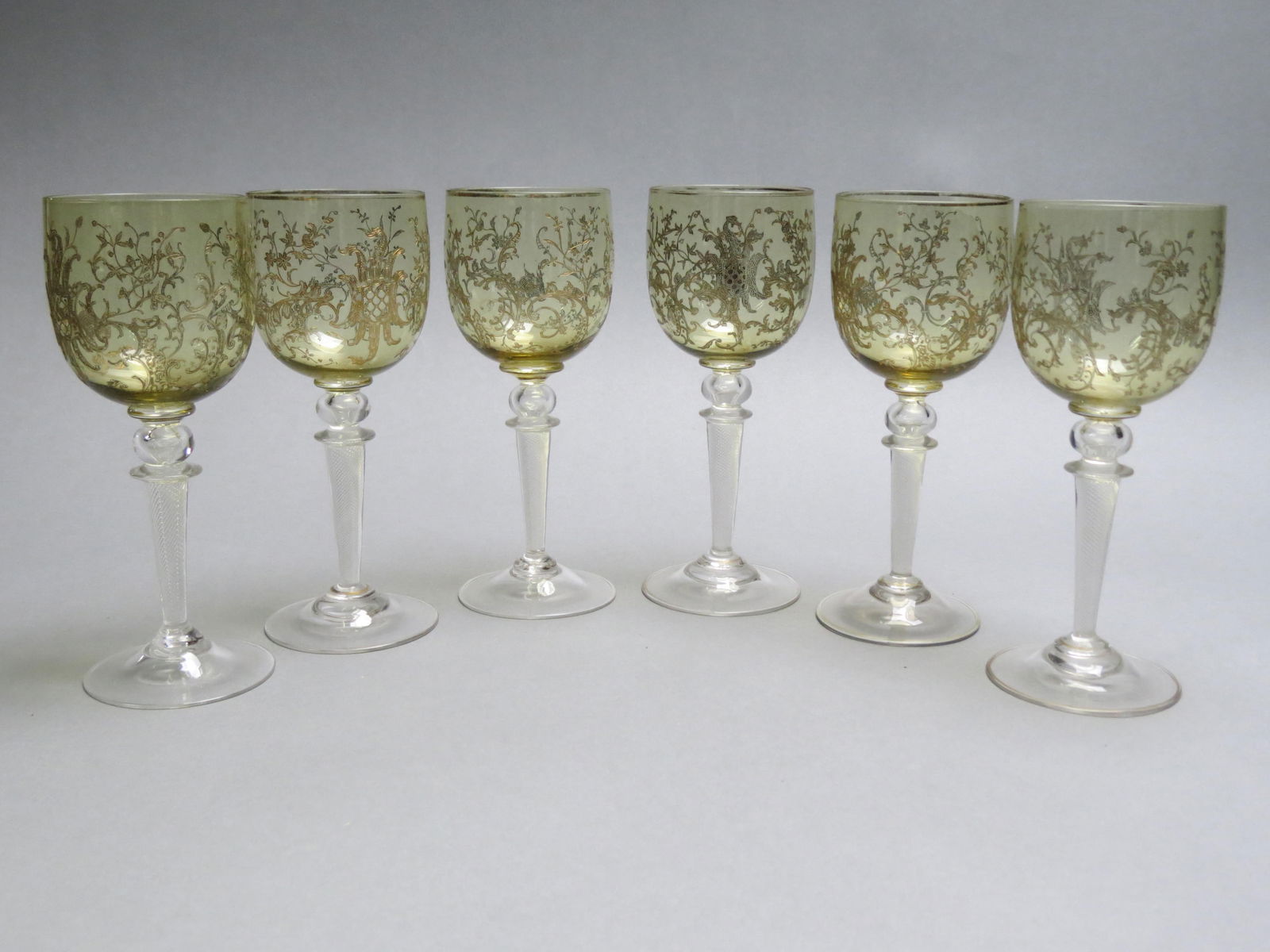 6 Art Glass Wine Goblets,: gold decoration on topaz with clear hollow twist stems, amazing detail, 7" tall.