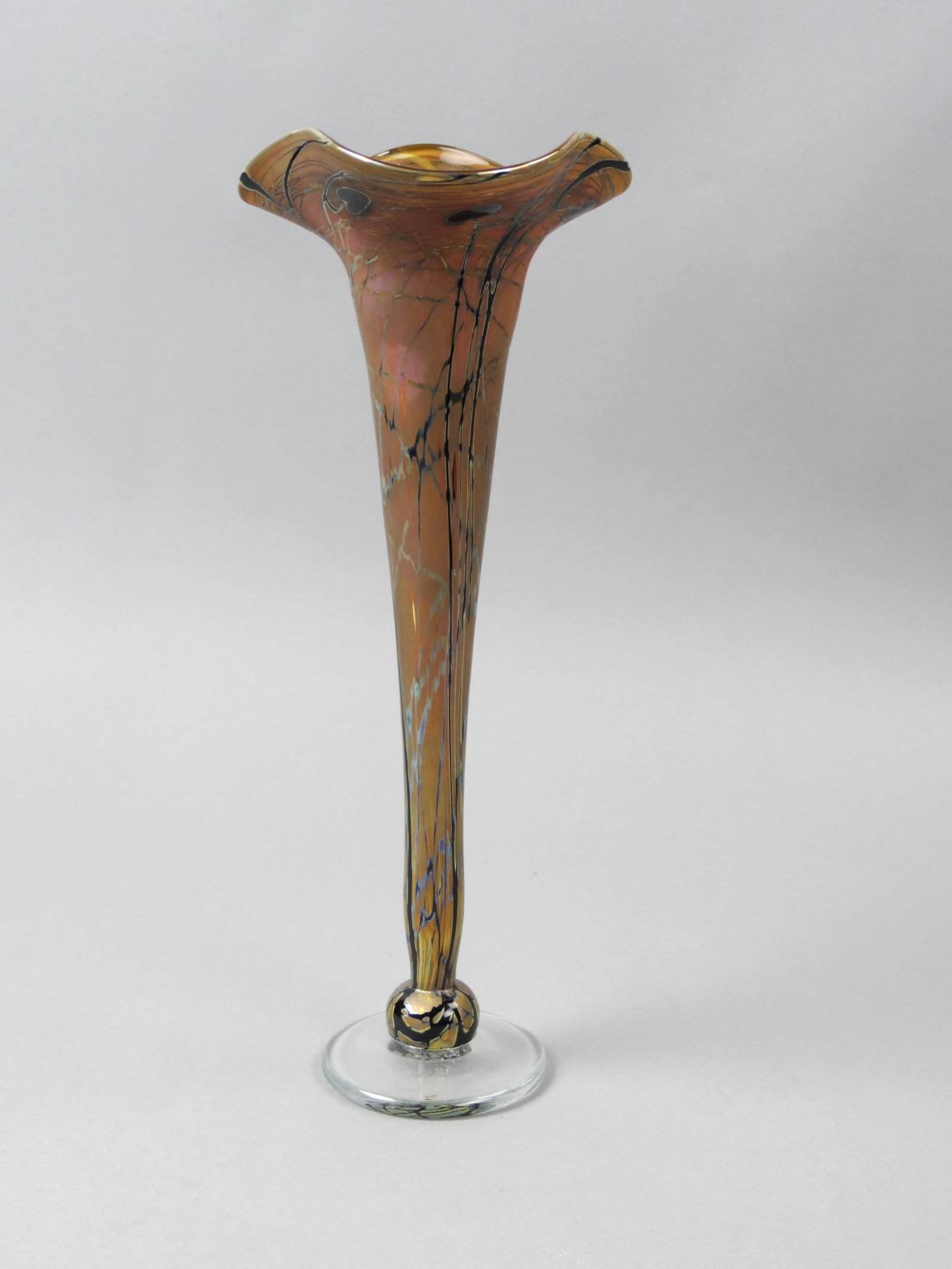 Zweifel Studios Art Glass Trumpet Vase,: trailing heart and vine on golden iridescent, clear base, 10 3/4", excellent....Craig Zweifel was born in 1944 in San Diego, and raised in Oakland, California. He began working with glass under Dr. Ro