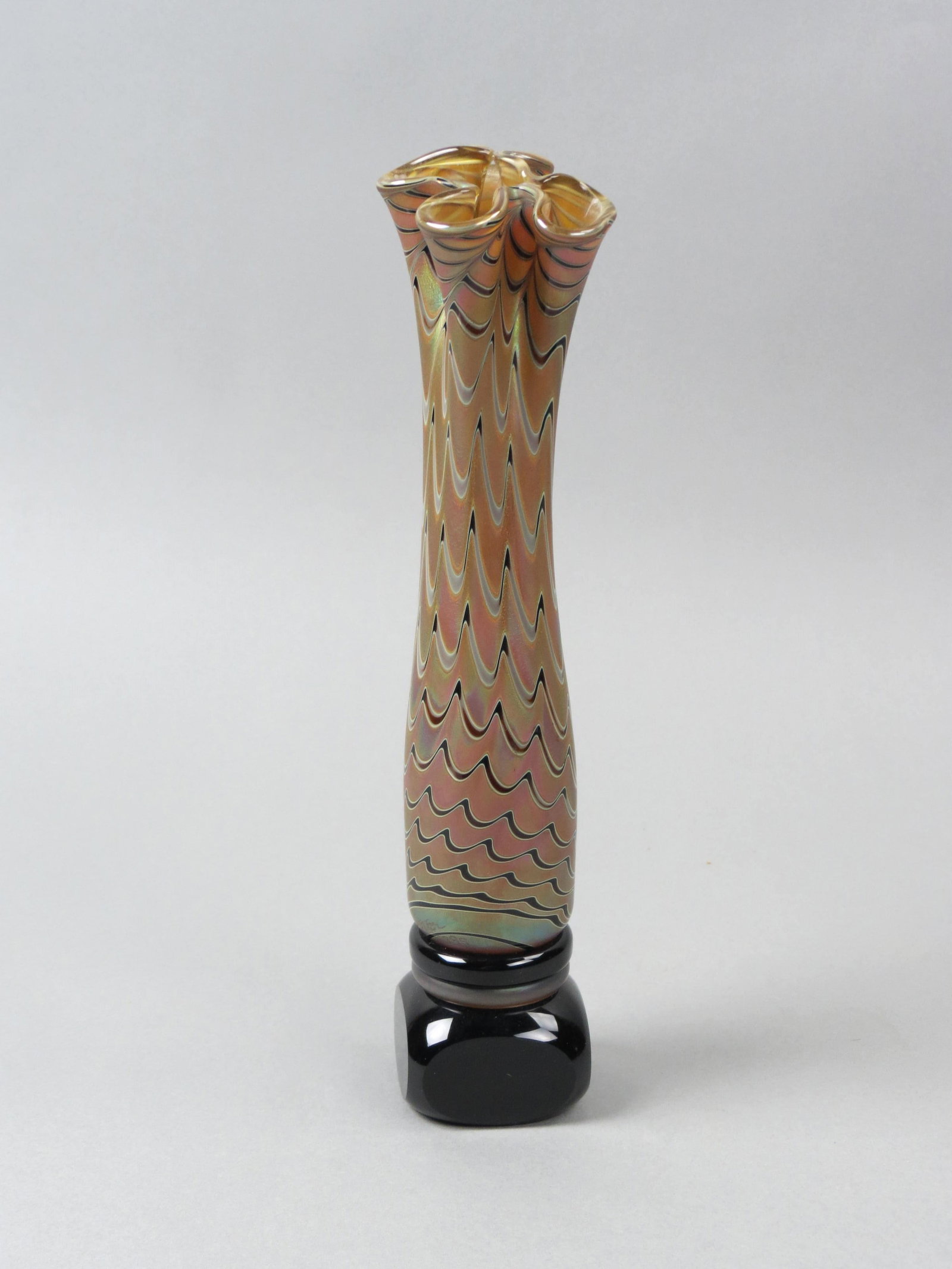 Zweifel Studios Art Glass Vase,: drapery design on rainbow iridescent, black base with rings, 9 3/4" excellent.....Craig Zweifel was born in 1944 in San Diego, and raised in Oakland, California. He began working with glass under Dr. 