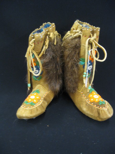 Indian Boots,: beaded leatherwork , fur trim.