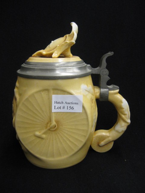 Antique Schierholz Lithophane Cyclist Stein,: high wheel cycle with scene in base, marked L.A.W., circa 1890, excellent, 1/2 liter, 6 1/2".... HIGH WHEEL BICYCLE porcelain stein, made by SCHIERHOLZ in Germany around 1900- the L A W on the lid sta