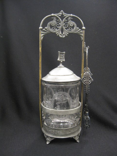 Victorian Pickle Castor,: Venus & cupid pattern glass insert, silverplate holder & tongs, signed Pairpoint, glass excellent, silverplate is worn.
