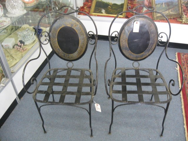 Pair of Victorian Tole Decorated Chairs,: metal, with arms, oval medallion backs, old label from Christies, NYC on reverse.