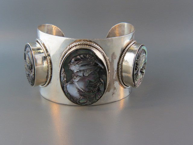 Cameo Bracelet,: a trio of carved oval abalone portraits in sterling silver, 2" wide, 83 grams.