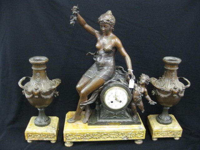 French Victorian Figural Mantle Clock Set,: bronzed maiden with cherub, "Les Rose" after J. Garnier, with side urns, clock is 25" tall, working